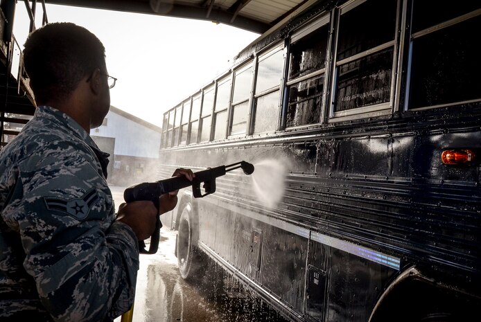 Airman 1st Class Jesse Brown, 628th Logistics Readiness Squadron vehicle operator, conducts a routine cleaning of a 44 passenger bus Jan. 28, 2015, at Joint Base Charleston, S.C. The buses are scheduled to be washed three times a month, unless additional cleaning is needed, by members of the LRS vehicle operations. The buses are used to transport individuals (Aircrews, tours, etc.) to and from the flight line. (U.S. Air Force Photo / Senior Airman Tom Brading )