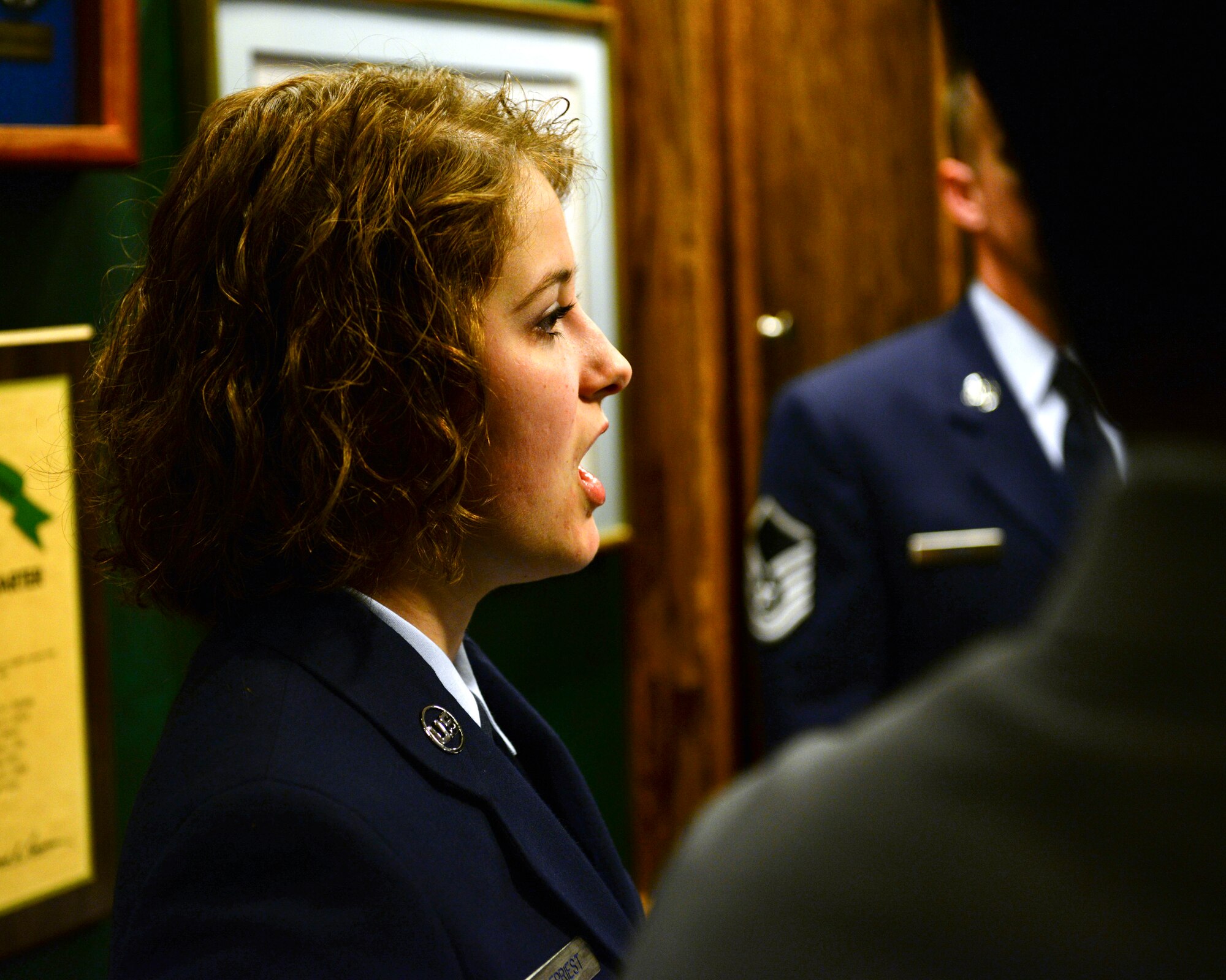Airman 1st Class Bri?r DePriest, 608th Air Communications Squadron client systems technician, sings the national anthem during a retirement ceremony at Barksdale Air Force Base, La., Jan. 30, 2015. DePriest was recently selected to audition for Tops in Blue after submitting the 2015 Worldwide Talent Search application for the Air Force Mission Audition. (U.S. Air Force photo/ Airman 1st Class Curt Beach)
