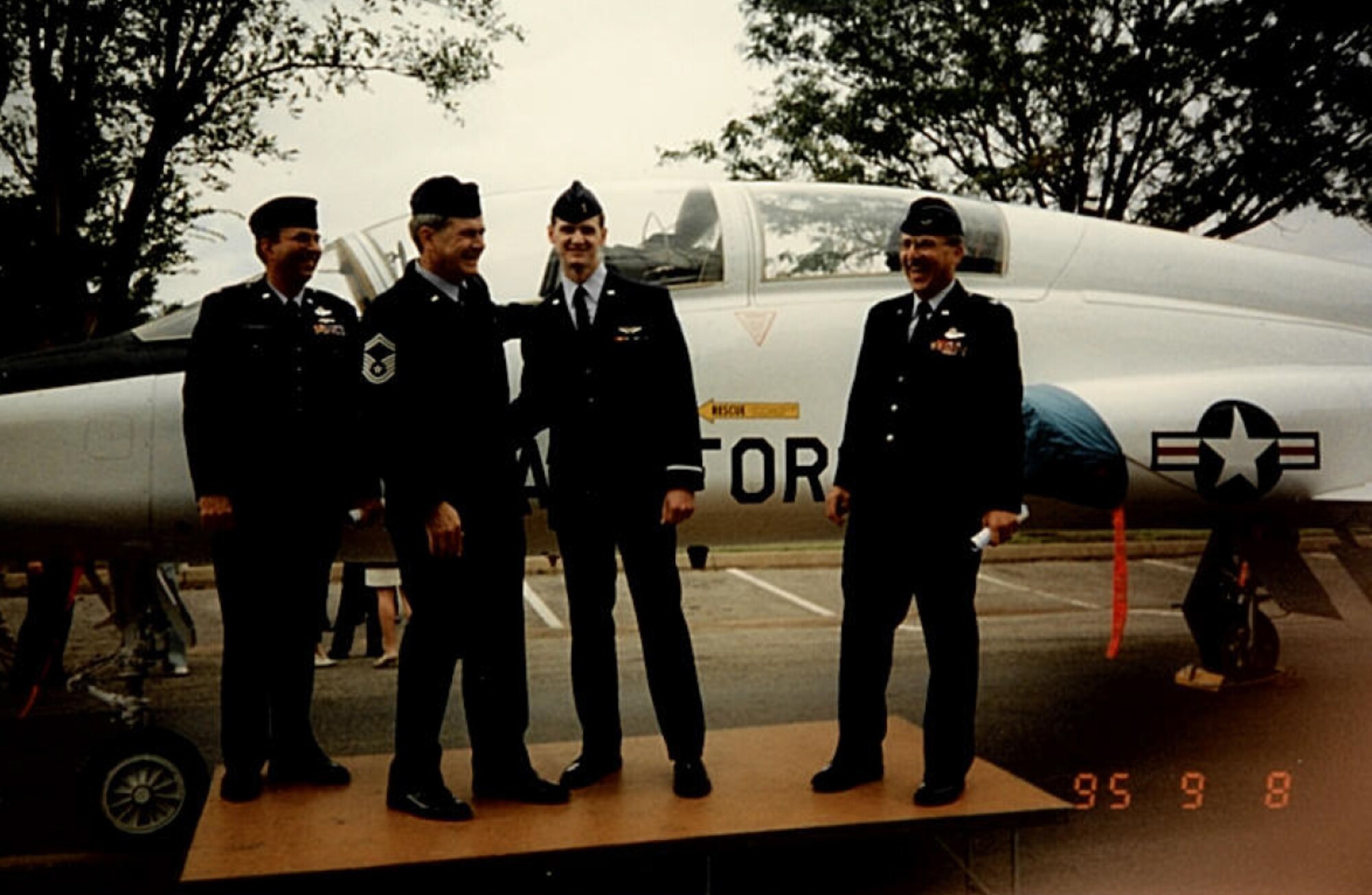 Senior Master Sgt. Stephen Humphrey (left middle) and his son then 2nd Lt. Ken Humphrey pose for a picture after the lieutenant received his pilot wings. (Courtesy photo) 