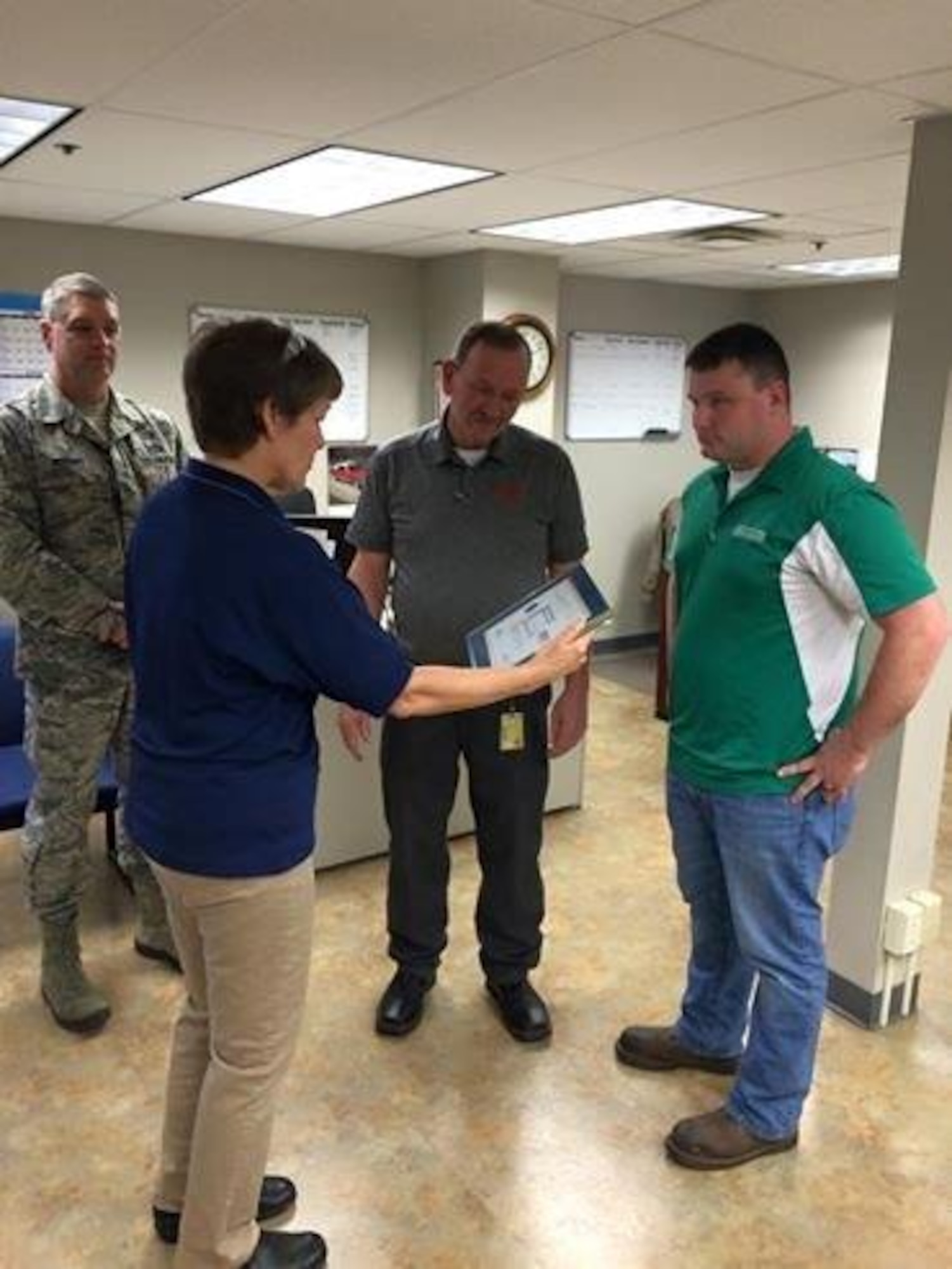 Dwayne Shackelford, third from left, is presented the Employer Support of the Guard and Reserve Patriot Award Jan. 16, 2015 at Baldor Electric in Fort Smith, Ark. From left, Chief Master Sgt. Ron Redding, Lt. Col. Judith Mathewson and Airman 1st Class Barry Jordan present the award to Shackelford. Mathewson is the 188th Mission Support Group deputy commander and Brewer and Redding are assigned to the 188th Civil Engineer Squadron. (Courtesy photo)