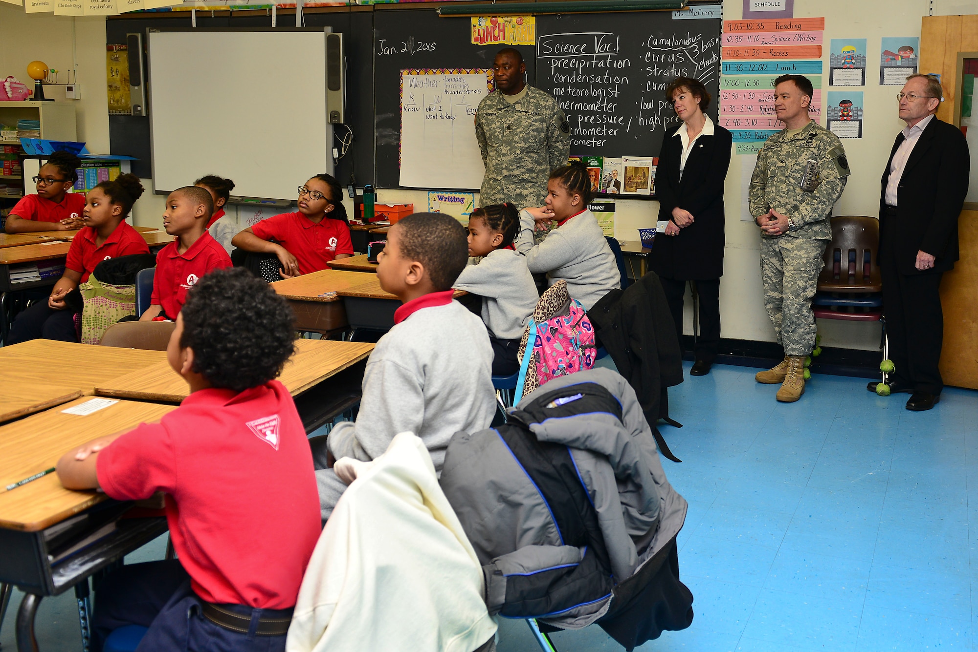 The 733rd Mission Support Group command team observes a classroom in the Achievable Dream Academy Elementary School in Newport News, Va., Jan. 29, 2015. The team toured the school and observed how Fort Eustis U.S. Army Soldiers assist students throughout the year. (U.S. Air Force photo by Senior Airman Kimberly Nagle/Released)