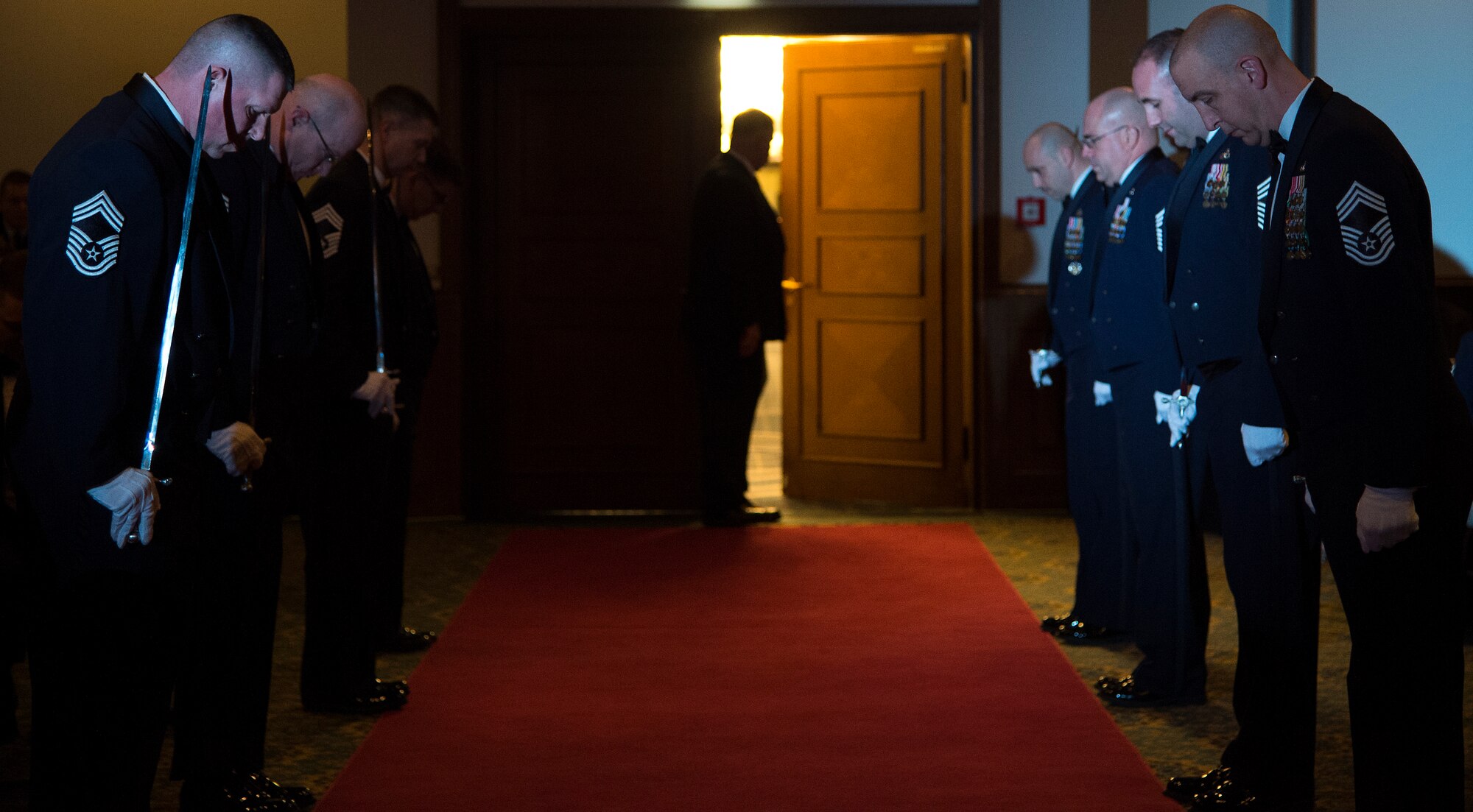 Members of the saber team get into position during a chief recognition ceremony at Ramstein Air Force Base, Germany, Jan. 30, 2015. The ceremony was held for thirty six servicemembers throughout Ramstein who recently earned the rank of chief master sergeant. (U.S. Air Force photo/Senior Airman Damon Kasberg)
