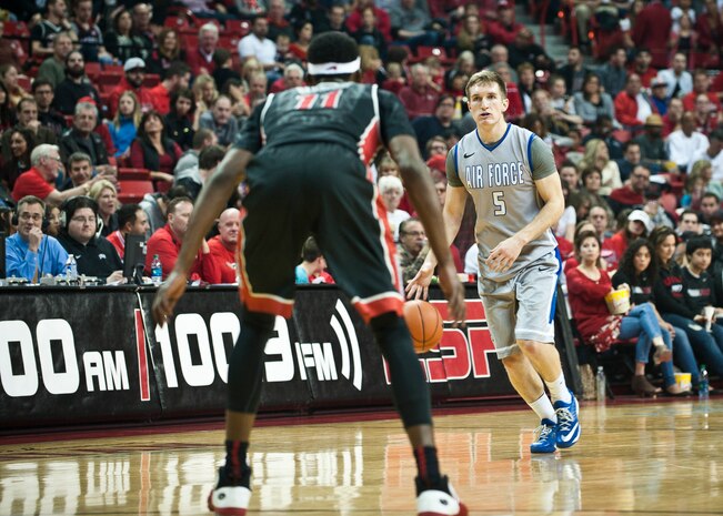 Air Force Academy guard Zach Kocur brings the ball down the court during a game against the University of Nevada-Las Vegas at the Thomas and Mack Center in Las Vegas Jan. 31, 2015. Kocur, who scored eight points in the game, has shot 50 percent from the field en route to 138 points scored for the season so far. (U.S. Air Force photo by Staff Sgt. Siuta B. Ika)
