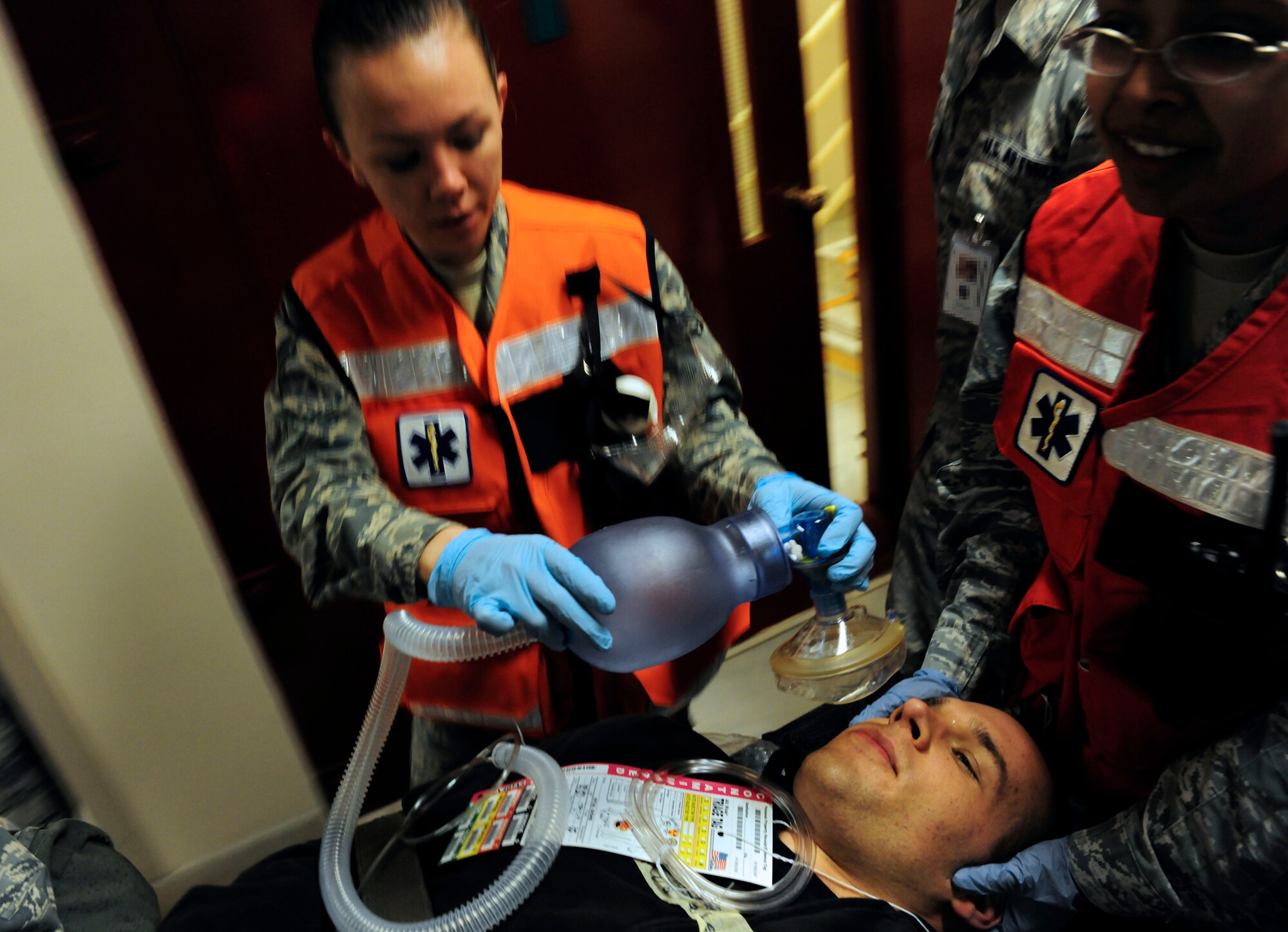 Airman 1st Class Jessica Hoyle, 39th Medical Operations Squadron medical technician, simulates providing oxygen to a patient during a base-wide exercise Jan. 28, 2015, at Incirlik Air Base, Turkey. As part of the exercise multiple patients were transported to the base clinic with simulated injuries. (U.S. Air Force photo by Senior Airman Krystal Ardrey/Released)