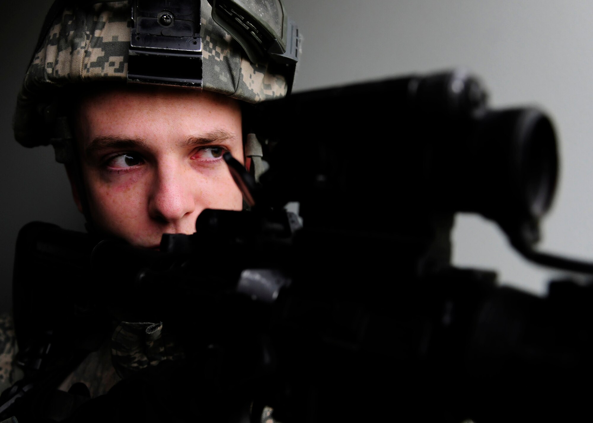 Airman 1st Class Luke Swancutt, 39th Security Forces Squadron monitoring facility operator, provides rear security during a base-wide exercise Jan. 28, 2015, at Incirlik Air Base, Turkey. The exercise involved an active shooter scenario and a mass casualty event to test the capabilities of first responders. (U.S. Air Force photo by Senior Airman Krystal Ardrey/Released)