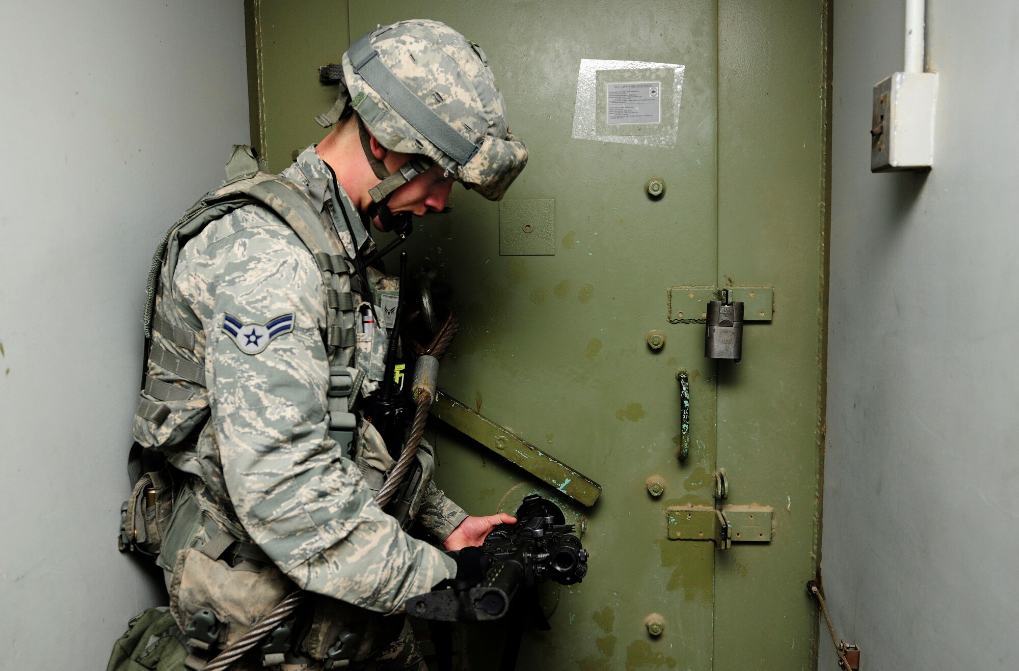 An Airman from the 39th Security Forces Squadron provides suppressive fire into a aircraft shelter during a base-wide exercise Jan. 28, 2015, at Incirlik Air Base, Turkey. The exercise tested the 39th SFS defenders response to active shooters in and around an aircraft shelter. (U.S. Air Force photo by Senior Airman Krystal Ardrey/Released)
