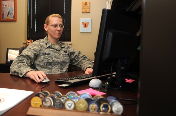 Company Grade Officer of the Year: Capt. Erin Holland, 4th Force Support Squadron Manpower and Personnel Flight commander, distributes work assignments at Seymour Johnson Air Force Base, North Carolina, Jan. 28, 2015. “You’re only as strong as the people you work with. I wouldn’t be where I am without them kicking butt every day.” (U.S. Air Force photo/Senior Airman Ashley J. Thum)