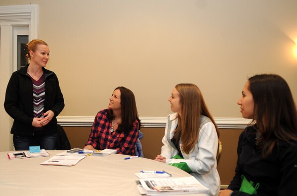 Key Spouse of the Year: Christine Harter, 4th Civil Engineer Squadron key spouse, interacts with spouses new to the base during a Newcomer’s Orientation at Seymour Johnson Air Force Base, North Carolina, Jan. 27, 2015. “I saw that spouses needed more support, and with the help of squadron leadership and my first sergeant, I helped fill that need.” (U.S. Air Force photo/Senior Airman Ashley J. Thum)