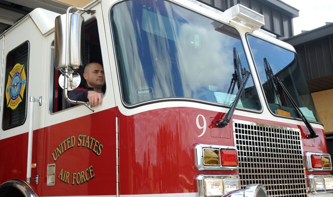 Junior Grade Civilian of the Year: Robert Columbus, 4th Civil Engineer Squadron Fire Station 2 lead firefighter, rolls out in a fire truck at Seymour Johnson Air Force Base, North Carolina, Jan. 30, 2015. “I attribute my success to my leadership in every tier – from my supervisor to the fire chief and up to wing leadership. They created an environment that allowed me to accomplish what I needed to accomplish.” (U.S. Air Force photo/Senior Airman Ashley J. Thum)
