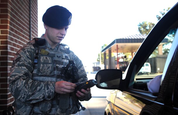 Honor Guard Member of the Year: Senior Airman Daniel Shores, 4th Security Forces Squadron defender, verifies a driver’s identity at Seymour Johnson Air Force Base, North Carolina, Jan. 28, 2015. “I couldn’t have been successful last year without the support of my leadership who always push me to strive for my best.” (U.S. Air Force photo/Senior Airman Ashley J. Thum)