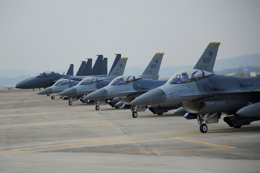 Four F-16 Fighting Falcons and four F-15K Slam Eagles prepare to take-off to conduct their first aerial formation training scenario during Exercise Buddy Wing 15-2 at Daegu Air Base, Republic of Korea, Feb. 3, 2015. Buddy Wing exercises are part of a combined fighter exchange program designed to improve interoperability between U.S. Air Force and ROK Air Force fighter units. (U.S. Air Force photo by Senior Airman Divine Cox/Released)