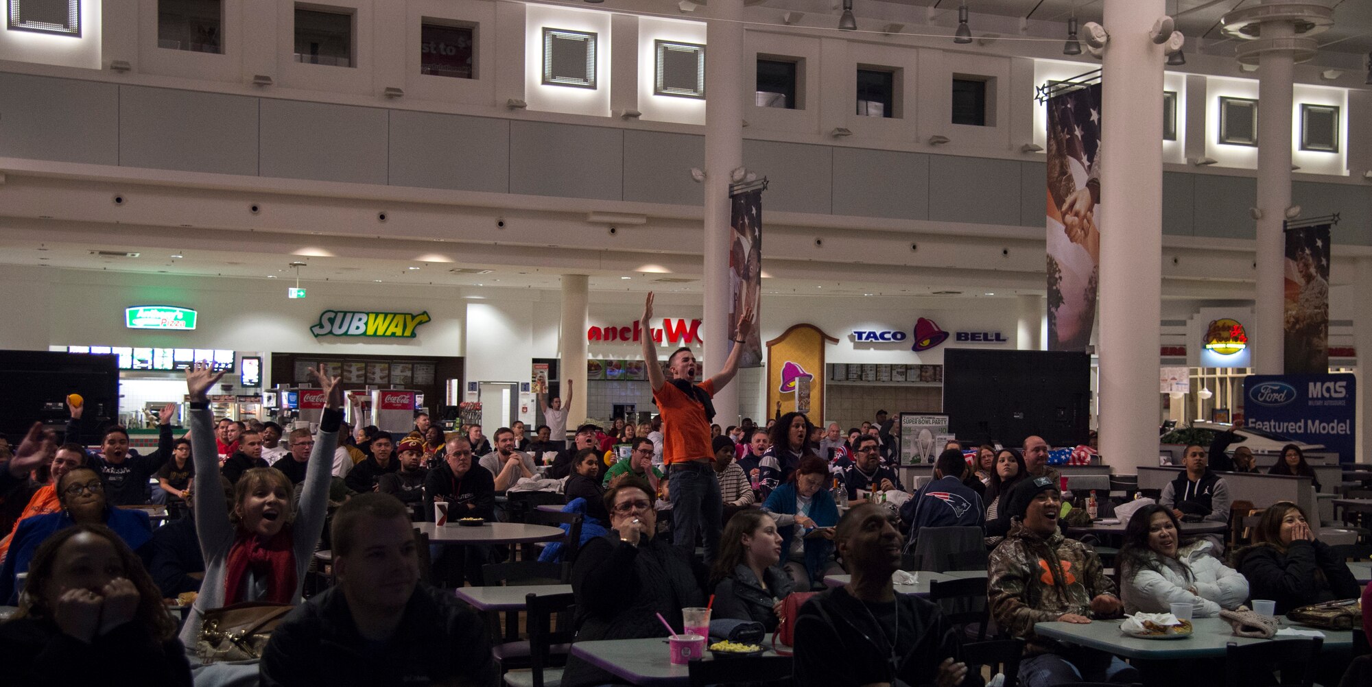 Seattle Seahawk fans celebrate after their team scored a touchdown against the New England Patriots during Super Bowl XLIX at Ramstein Air Base, Germany, Feb. 1, 2015. New England won the super bowl after stopping Seattle in the final minute of the game. (U.S. Air Force photo/Senior Airman Damon Kasberg)