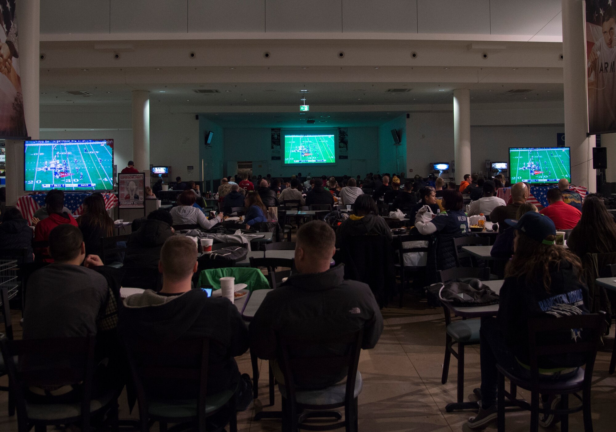 Fans watch Super Bowl XLIX at the Exchange on Ramstein Air Base, Germany, Feb. 1, 2015. Members of the Kaiserslautern Military Community watched the super bowl throughout Ramstein, staying up until the early morning to see who would take home the championship. (U.S. Air Force photo/Senior Airman Damon Kasberg)