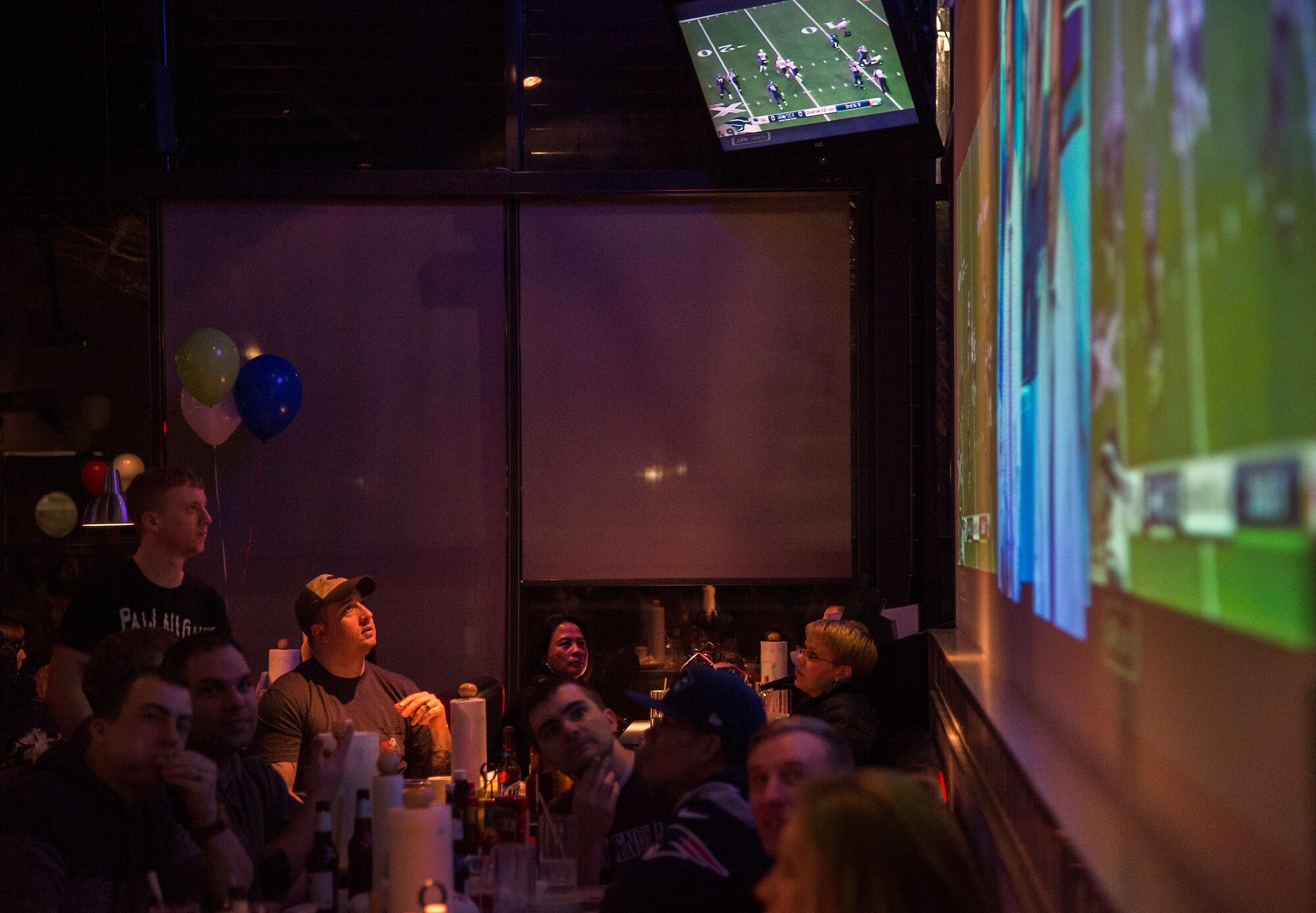 Fans watch as the Seattle Seahawks and the New England Patriots compete in Super Bowl XLIX at Ramstein Air Base, Germany, Feb. 1, 2015. In a close game New England was crowned the champions after stopping Seattle from scoring in the last minute of the game. (U.S. Air Force photo/Senior Airman Damon Kasberg)