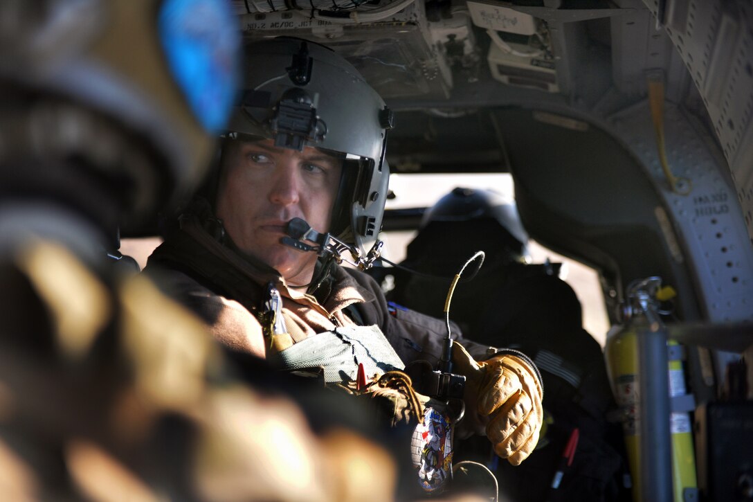 An Air National Guard airman gives the ready signal during combat ...