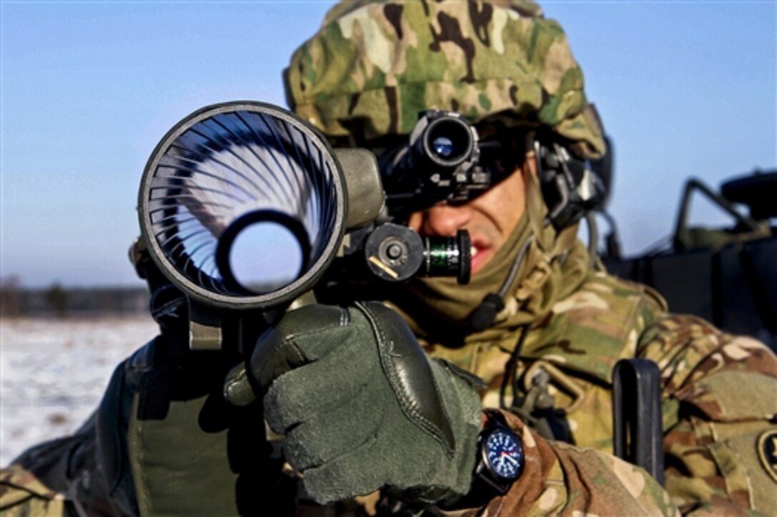 A U.S. soldier looks through the sight of a Lithuanian rocket launcher during a training exercise in Rukla, Lithuania, Feb. 2, 2015. The soldier is assigned to 3rd Squadron, 2nd Cavalry Regiment.