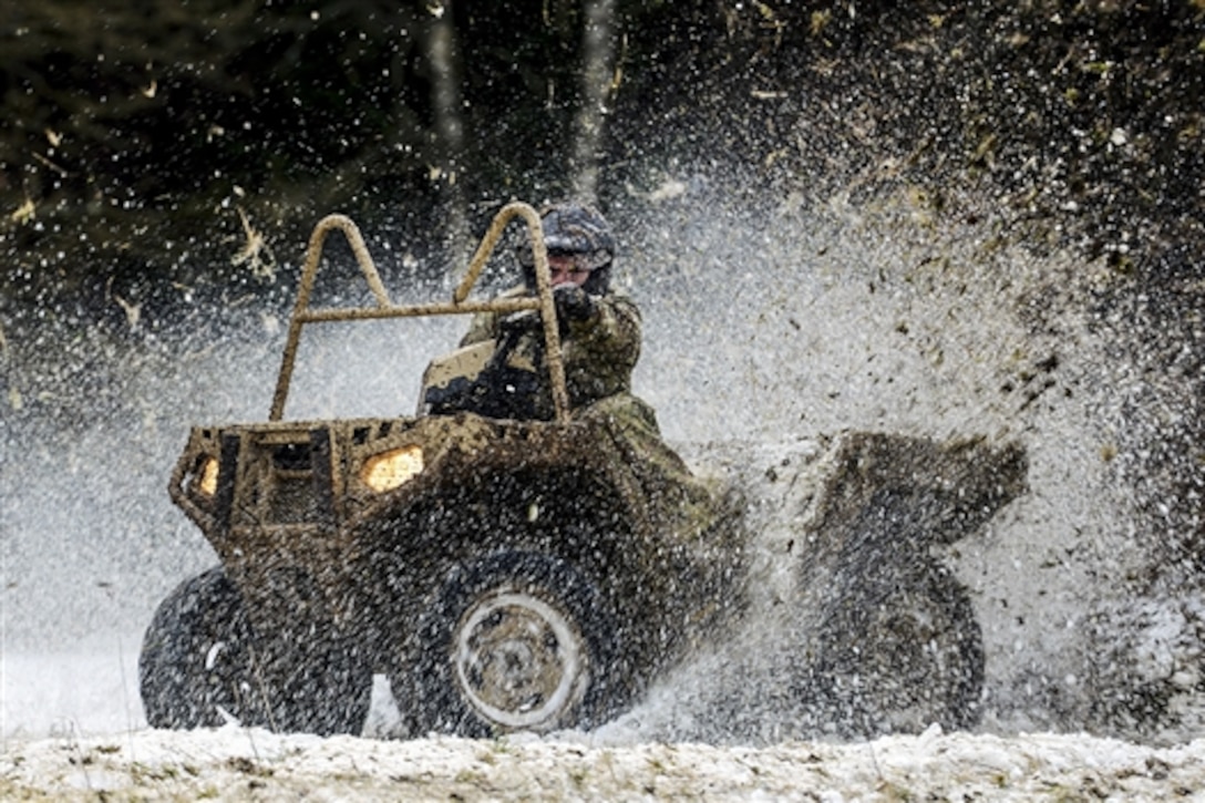 U.S. Army Sgt. Gordon Scott shows what an all-terrain vehicle can do to soldiers during a safety course in Boeblingen, Germany, Jan. 29, 2015. Scott is assigned to 1st Battalion, 10th Special Forces Group. The solders are assigned to 554th Military Police Company.