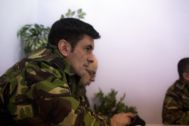A Romanian Marine sits through the naval infantry squad offensive tactics and procedures workshop given by U.S. Marines in Babadag, Romania, Jan. 29. The workshop reviewed tactics and maneuvers in a classroom setting, ensuring all participants had a clear understanding of the basic movements. The Romanians and  U.S. Marines  compared the use of small-unit leaders and found ways to adapt these responsibility’s in to their squad-sized tactics.  