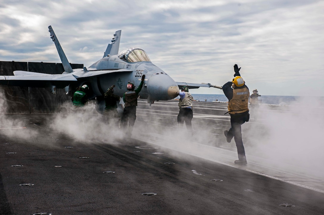 An F/A-18 Hornet assigned to the Gladiators of Strike Fighter Attack Squadron (VFA) 106 prepares to launch from the flight deck of the aircraft carrier USS Theodore Roosevelt (CVN 71).  Theodore Roosevelt is underway preparing for future deployments. 