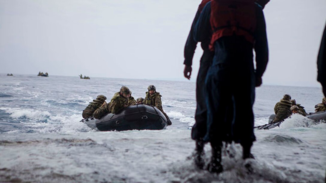 U.S. Marines with Company F, Battalion Landing Team, 2nd Battalion, 4th Marines, 31st Marine Expeditionary Unit approach the stern gate during boat operations using Combat Rubber Raiding Craft from the well deck of the USS Bonhomme Richard, at sea, Feb. 2, 2015. Marines and Sailors launched and recovered the Combat Rubber Raiding Craft in preparation for their upcoming patrol. (U.S. Marine Corps photo by GySgt Ismael Pena/ Released)