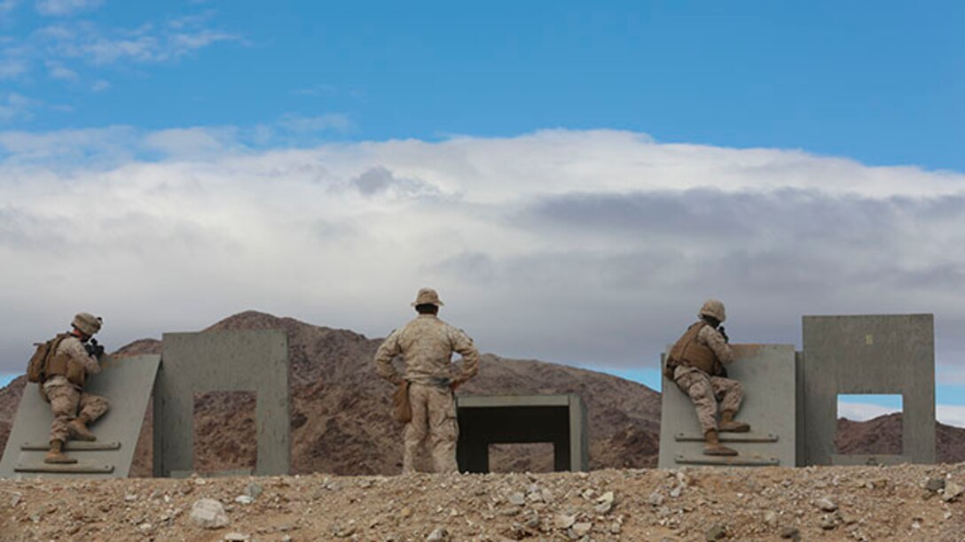 U.S. Marines with Combat Logistics Detachment 1, Combat Logistics Battalion 13, 1st Marine Logistics Group, shoot their rifle during an unknown distance range from simulated rooftops during Integrated Training Exercise 2-15 at Camp Wilson on Twentynine Palms, Calif., Jan. 31, 2015. ITX 2-15, executed by Special Purpose Marine Air Ground Task Force 4, is conducted to enhance the integration and warfighting capability of all elements of the Marine Air Ground Task Force. (U.S. Marine Corps photo by Lance Cpl. Kathryn Howard, 1st Marine Logistics Group Combat Camera/Released)