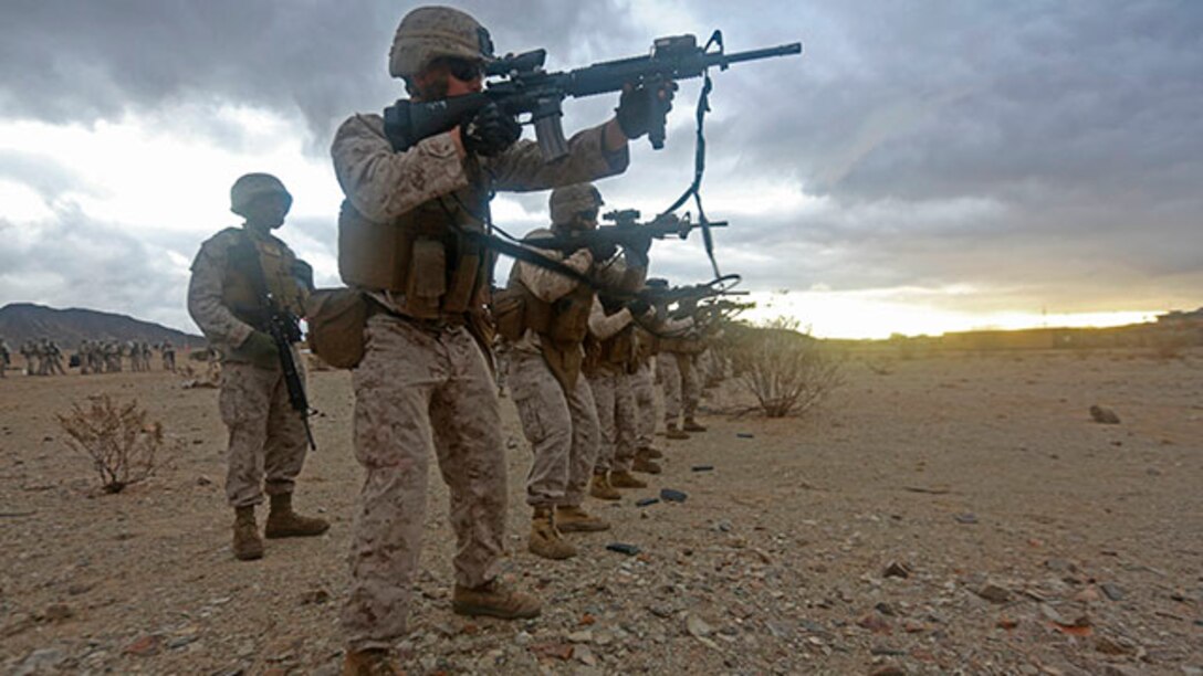 U.S. Marines with Combat Logistics Detachment 1, Combat Logistics Battalion 13, 1st Marine Logistics Group, practice reloading their weapons during Integrated Training Exercise 2-15 at Camp Wilson on Twentynine Palms, Calif., Jan. 31, 2015. ITX 2-15, executed by Special Purpose Marine Air Ground Task Force 4, is conducted to enhance the integration and warfighting capability of all elements of the Marine Air Ground Task Force. (U.S. Marine Corps photo by Lance Cpl. Kathryn Howard, 1st Marine Logistics Group Combat Camera/Released)