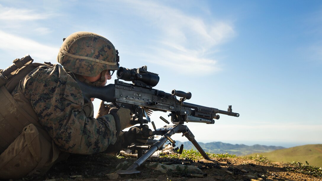 U.S. Marine Lance Cpl. Alexander Basco engages targets with his M240B machine gun during squad tactics and maneuver training aboard Camp Pendleton, Calif., Jan. 27, 2015. Bosco is a rifleman with Kilo Company, Battalion Landing Team 3rd Battalion, 1st Marine Regiment, 15th Marine Expeditionary Unit. As the ground combat element for the 15th MEU, BLT 3/1 is preparing for their upcoming deployment by enhancing their combat skills and learning to work as a cohesive unit. 
