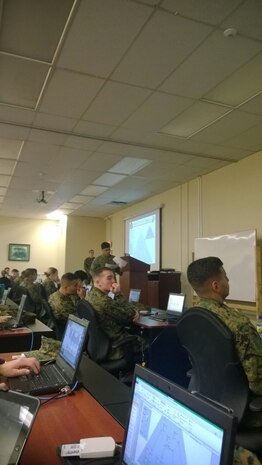 2ndLt Jessica Munter presenting an active directory diagram with Capt Jesus A. Ochoa explaining different concepts seen in the diagram.  