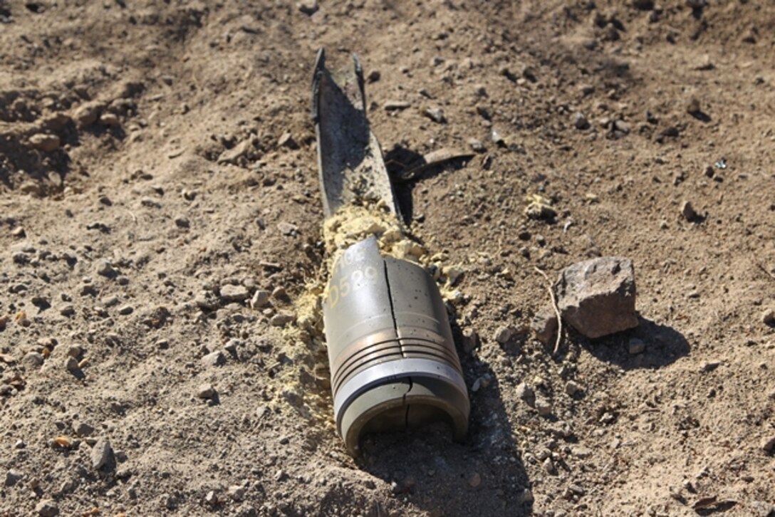 Marines of EOD Supervisor Course Class 2015020 perform low order techniques with 155mm high explosive projectiles.  