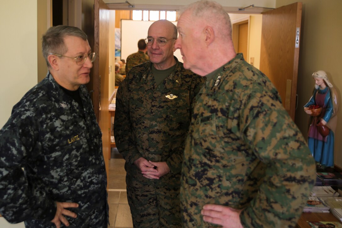 Navy Capt. Timothy Lantz, force chaplain for Navy Reserve Forces Command, Navy Capt. Stephen J. Shaw, force chaplain for Marine Force Reserve, and Lt. Gen. Richard P. Mills, commander of MARFORRES, discuss the relationship between chaplains and the Marine Corps at the MARFORRES annual training for Religious Ministry Teams aboard Naval Air Station Joint Reserve Base New Orleans, Feb. 3, 2015. More than 80 chaplains and religious program specialists throughout MARFORRES attended the annual training. Chaplains enhance mission readiness of Marines by creating more resilient personnel and families and strengthening the spiritual wellbeing of individual Marines. (U.S Marine Corps photo by Lance Cpl. Ian Ferro)
