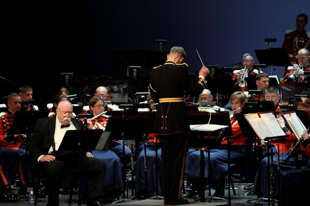 Marine Band performs Chris Brubeck's Quiet Heroes (A Symphonic Salute to the Flag Raisers of Iwo Jima), transcribed by Marine Band music production chief/staff arranger Master Sgt. Donald Patterson. Wilford Brimely narrates during the concert which honored the warriors of Iwo Jima on Feb. 23, 2011, at George Mason University’s Center for the Arts Concert Hall in Fairfax, Va.