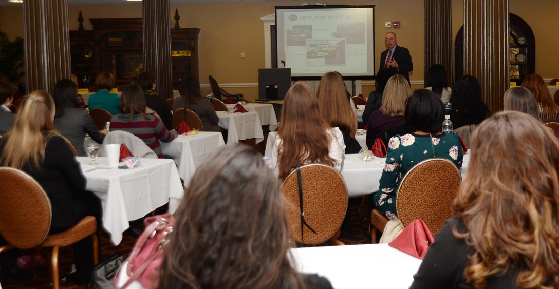 Michael Madden, Marine Corps Logistics Command, gives an overview of LOGCOM's mission and how it supports the entire Marine Corps to a group of spouses during the 2015 Military Spouses Leadership Conference. The daylong conference was held Feb. 4 at Town and Country Restaurant Grand Ballroom aboard Marine Corps Logistics Base Albany.