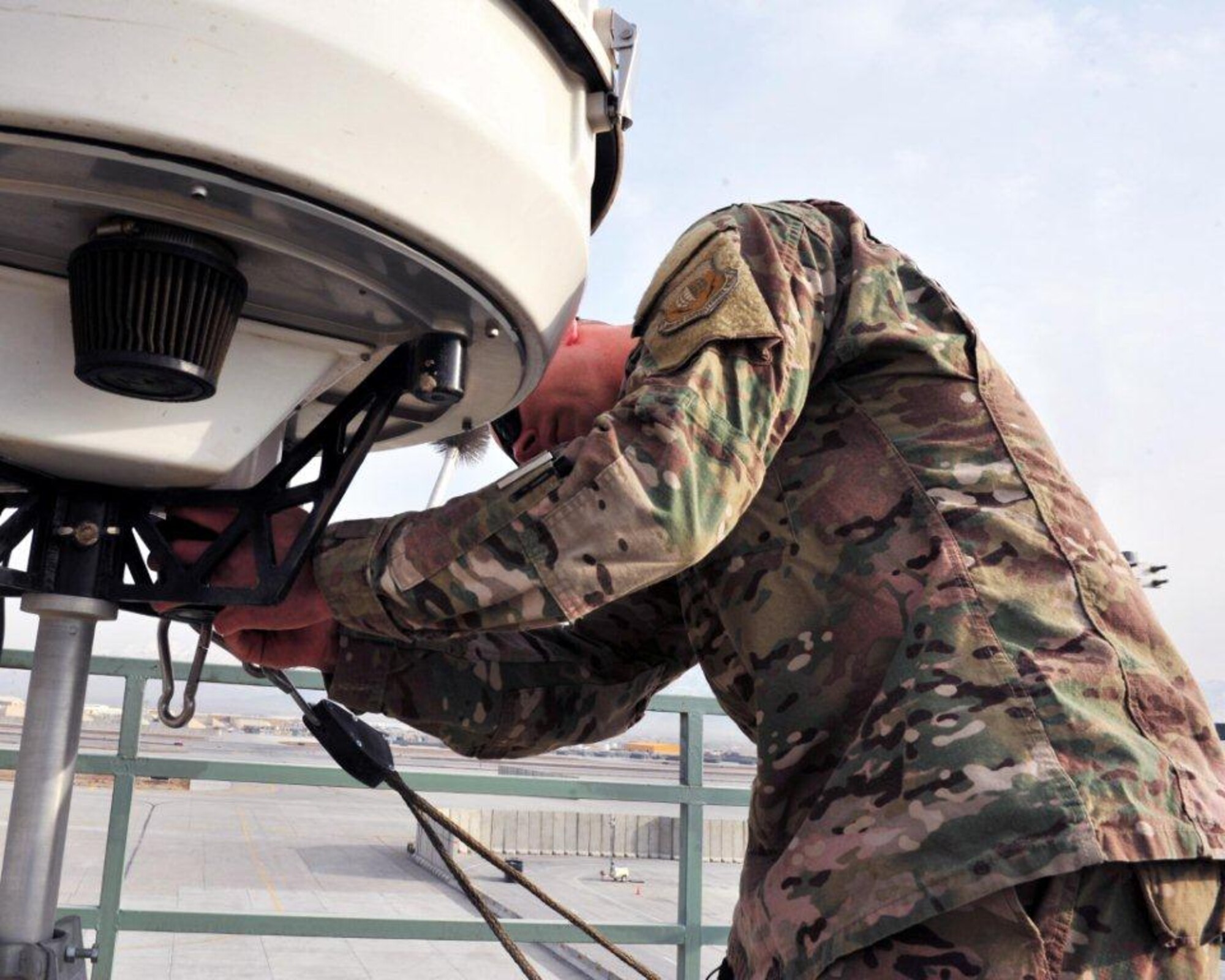Tech. Sgt. Timothy Lawson prepares to change a filter on meteorological equipment used to predict impending precipitation, Jan. 28, 2015, at Bagram Airfield, Afghanistan. Airmen assigned to the 455th Expeditionary Operations Support Squadron’s weather flight provide up-to-the-minute recommendations to pilots flying missions throughout the area of responsibility. Lawson is the 455th EOSS weather flight chief.   (U.S. Air Force photo/Staff Sgt. Whitney Amstutz)