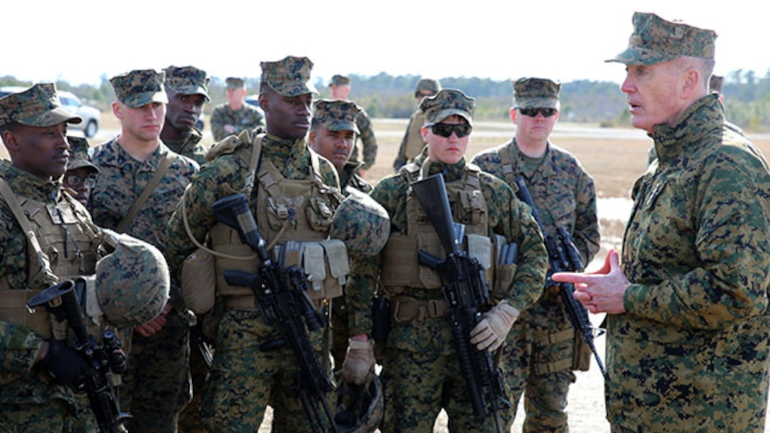 Commandant of the Marine Corps Gen. Joseph F. Dunford, Jr., speaks to Marines of Company A and Weapons Company during their final field exercise at Range G6 aboard Marine Corps Base Camp Lejeune, N.C., Feb. 3, 2015. Dunford visited GCEITF Marines to observe their training and discuss the future of the Corps, and how the Marines are helping shape a better Marine Corps. From October 2014 to July 2015, the GCEITF will conduct individual and collective level skills training in designated ground combat arms occupational specialties in order to facilitate the standards based assessment of the physical performance of Marines in a simulated operating environment performing specific ground combat arms tasks. (U.S. Marine Corps photo by Sgt. Alicia R. Leaders/Released)