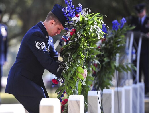 Tech. Sgt. Raymond Kessner, 18th Flight Test Squadron AC-130J sensor operator, lays a wreath during a remembrance ceremony at Barrancas National Cemetery on Naval Air Station Pensacola, Fla., Jan. 31, 2015. The ceremony honored the crew of AC-130H Spectre, Spirit 03, which was shot down Jan. 31, 1991, during the Battle of Khafji. (U.S. Air Force photo/Airman 1st Class Jeff Parkinson)