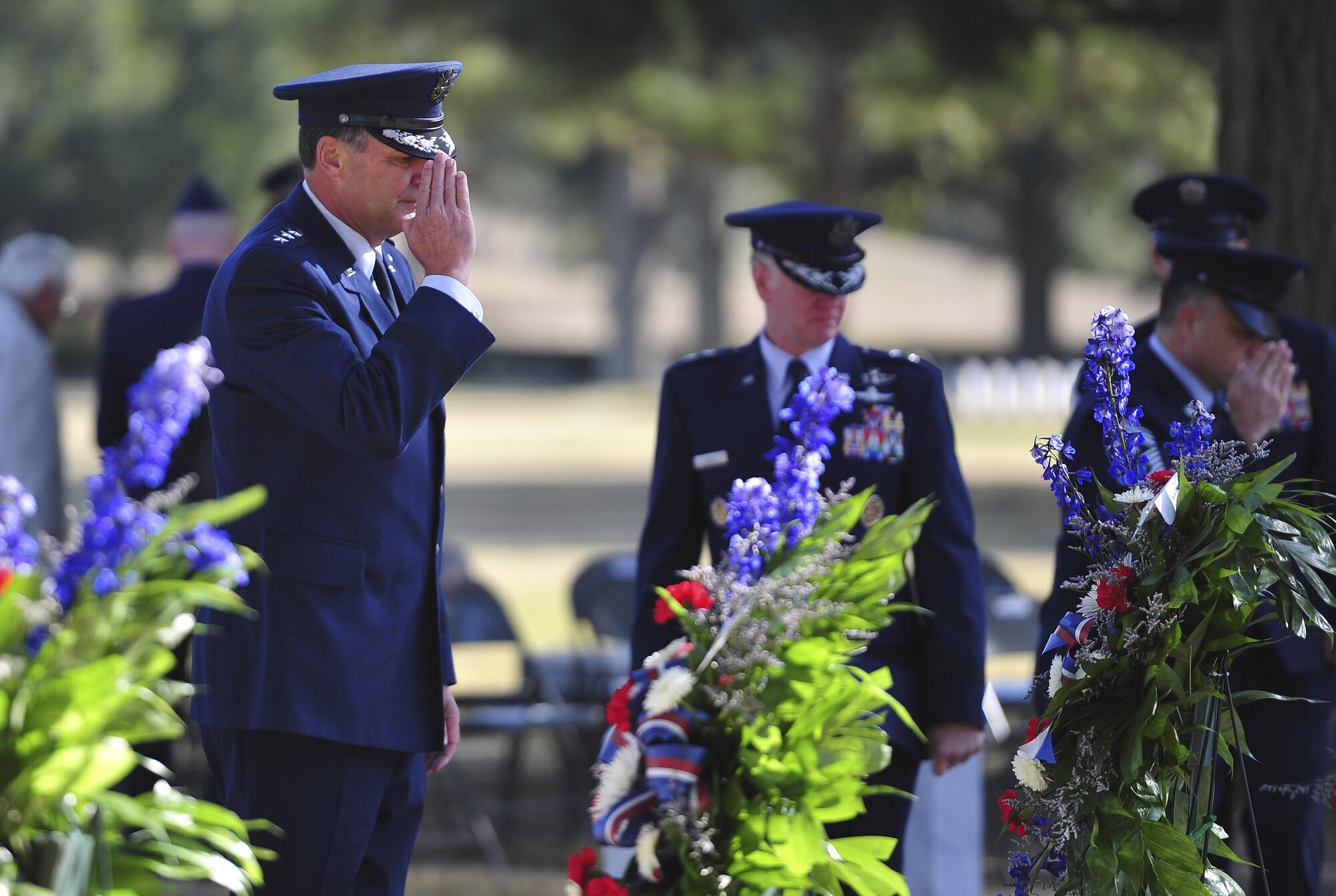 Lt. Gen. Brad Heithold, Air Force Special Operations Command commander, salutes the graves of Spirit 03 crew members during a remembrance ceremony at Barrancas National Cemetery on Naval Air Station Pensacola, Fla., Jan. 31, 2015. Losing Spirit 03 and its crew members was the largest single loss by an Air Force unit during Operation Desert Storm. (U.S. Air Force photo/Airman 1st Class Jeff Parkinson)