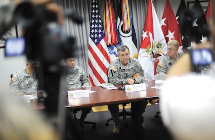 Gen. Peter Chiarelli, Vice Chief of Staff of the U.S. Army, center, responds to questions during a press conference at Joint Base Lewis McChord May 18 that was held to address concerns from a recently returned Oregon National Guard unit.