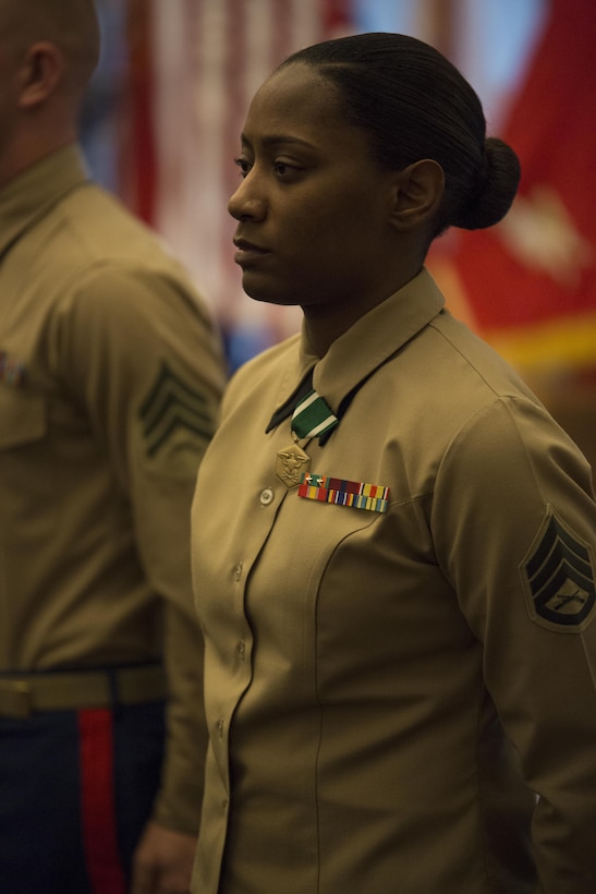 Staff Sgt. Wyanika M. Christophe, a Reserve career planner from 4th Amphibian Assault Battalion, 4th Marine Division, Marine Forces Reserve, stands after receiving a Navy and Marine Corps Commendation medal during Commandant of the Marine Corps 2014 Combined Awards Ceremony in Quantico, Va., Jan. 29, 2015. Christophe received the award for being the Career Planner of the Year. The ceremony recognized superior recruiters, drill instructors, combat Instructors, Marine security guards, career planners and Semper Fit male and female athletes of the year. Career planners play a critical role in retaining high quality Marines, an issue that the Commandant highlighted in his recently released planning guidance. (U.S. Marine Corps photo by Cpl. Gabrielle Quire/Released)