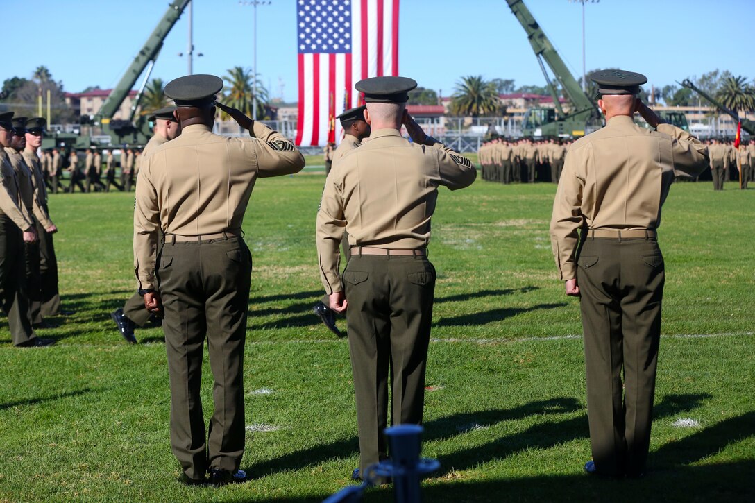 Sergeant Maj. Ronald Green, (left) Sgt. Major Bradley Kasal, and Lt. Gen. David H. Berger, I Marine Expeditionary Force commanding general, salute Marines of I MEF and they march in review during a relief and appointment ceremony aboard Marine Corps Base Camp Pendleton, Calif., Feb. 4, 2015. During the ceremony, the Marines bid farewell to Green as he prepares to assume his new post as the Sergeant Major of the Marine Corps, and welcomed Kasal as the new I MEF sergeant major. (U.S. Marine Corps photo by Cpl. Christopher J. Moore/Released)