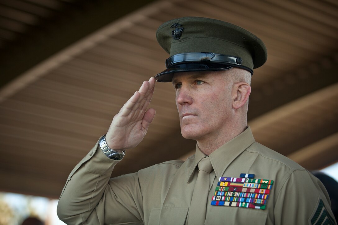 U.S. Marine Corps Sgt. Maj. Bradley A. Kasal salutes during the playing of the National Anthem during the I Marine Expeditionary Force Sergeant Major Relief and Appointment ceremony aboard Camp Pendleton, Calif., Feb. 4, 2015. During the ceremony, Sgt. Maj. Ronald L. Green was relieved by Sgt. Maj. Bradley A. Kasal. (U.S. Marine Corps photo by Sgt. Melissa Marnell, Combat Camera, MCIWEST-MCB CamPen/Released).
