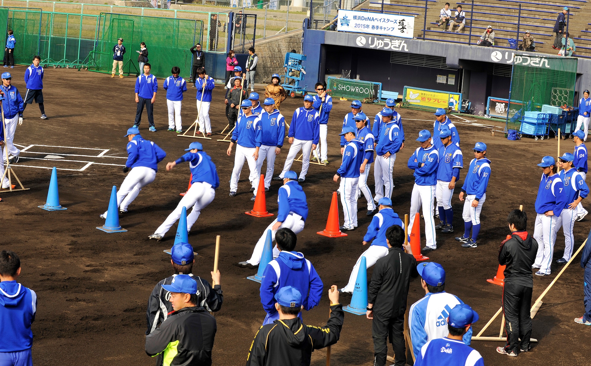 Yokohama DeNA Baystars perform agility drills during spring training camp at the Ginowan Municipal Baseball Stadium, Okinawa, Japan, Feb. 2, 2015. Every February, professional baseball teams in Japan come to Okinawa for the spring camp. (U.S. Air Force photo by Naoto Anazawa)