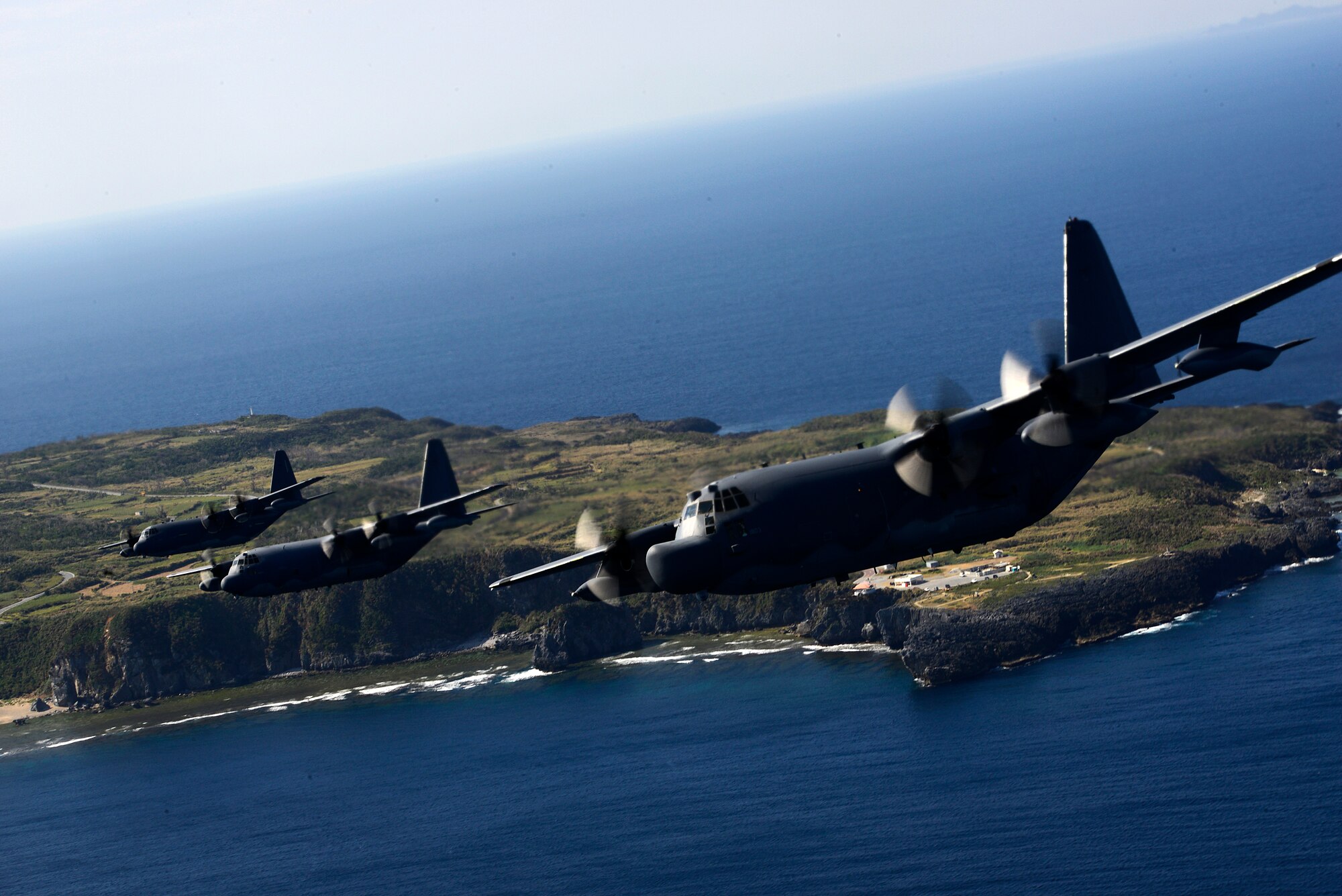 From left, an MC-130J Commando II and an MC-130P Combat Shadow both from the 17th Special Operations Squadron along with an MC-130H Combat Talon II from the 1st Special Operations Squadron conduct a heritage formation of three MC-130 variants off the coast of Okinawa, Japan, Jan. 26, 2015. The 353rd Special Operations Group performed the unique formation to commemorate the arrival of the MC-130J Commando II, the retirement of the MC-130P Combat Shadow and the continuing mission of the MC-130H Combat Talon II. (U.S. Air Force photo by Senior Airman Maeson Elleman)