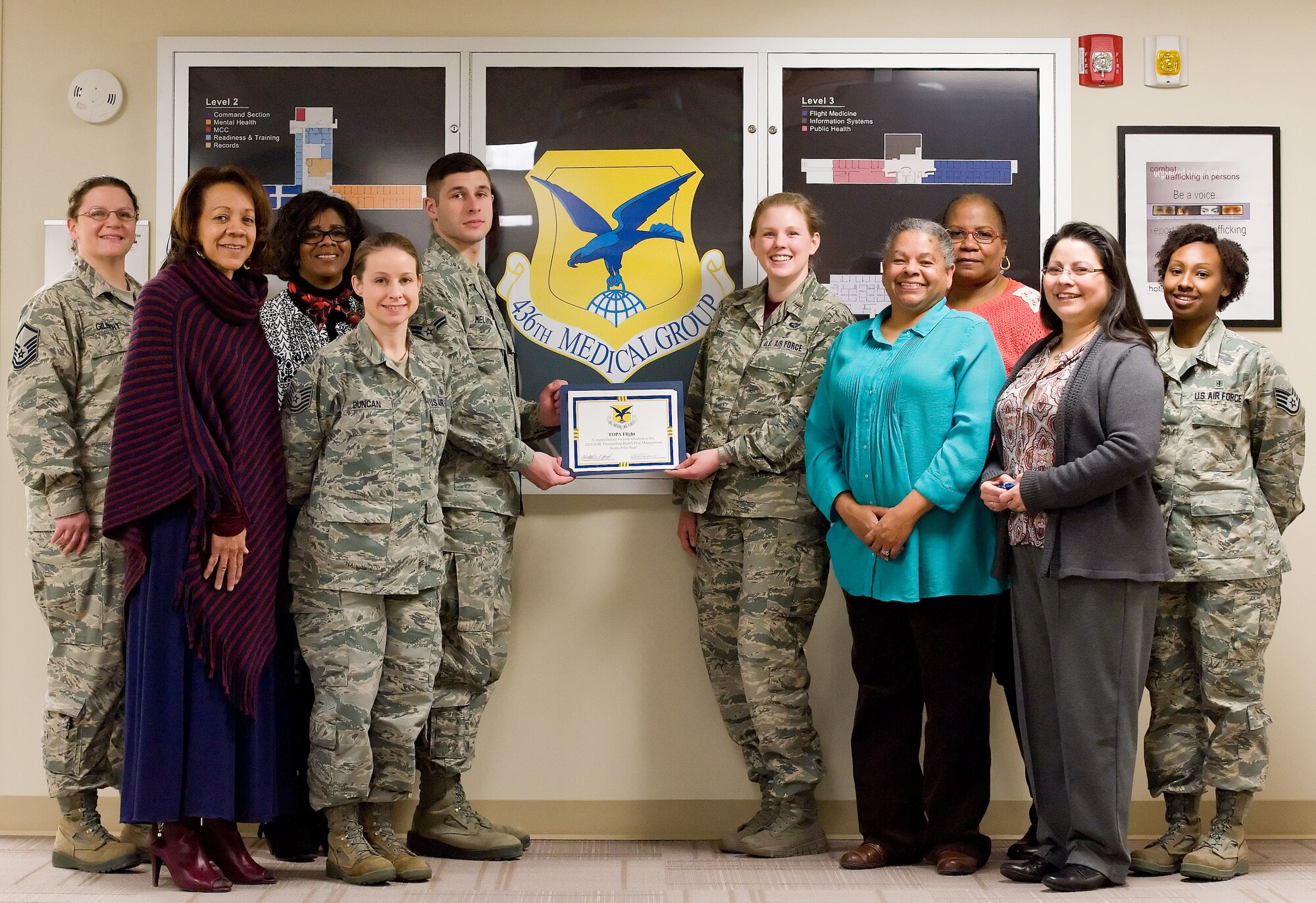 Members of the 436th Medical Support Squadron health plans management flight pose for photo Jan. 30, 2015, at the base clinic on Dover Air Force Base, Del. The flight won the Air Mobility Command 2014 Outstanding Health Plan Management of the Year award. (U.S. Air Force photo/Roland Balik)

