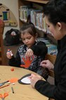 Sena Tenorio and her daughter, Athena, work on arts and crafts during the story telling program Jan. 22 at Joint Base San Antonio-Randolph’s Library. The base library provides access to information essential to the Air Force mission, supports professional military and voluntary education programs, and offers library facilities, resources, and services to enhance the quality of life for authorized customers. (U.S. Air Force photo by Johnny Saldivar)

