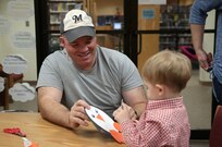 Paul Snyder and his son, William, work on arts and crafts during the story telling program Jan. 22 at the Joint Base San Antonio-Randolph Library. (U.S. Air Force photo by Johnny Saldivar)

