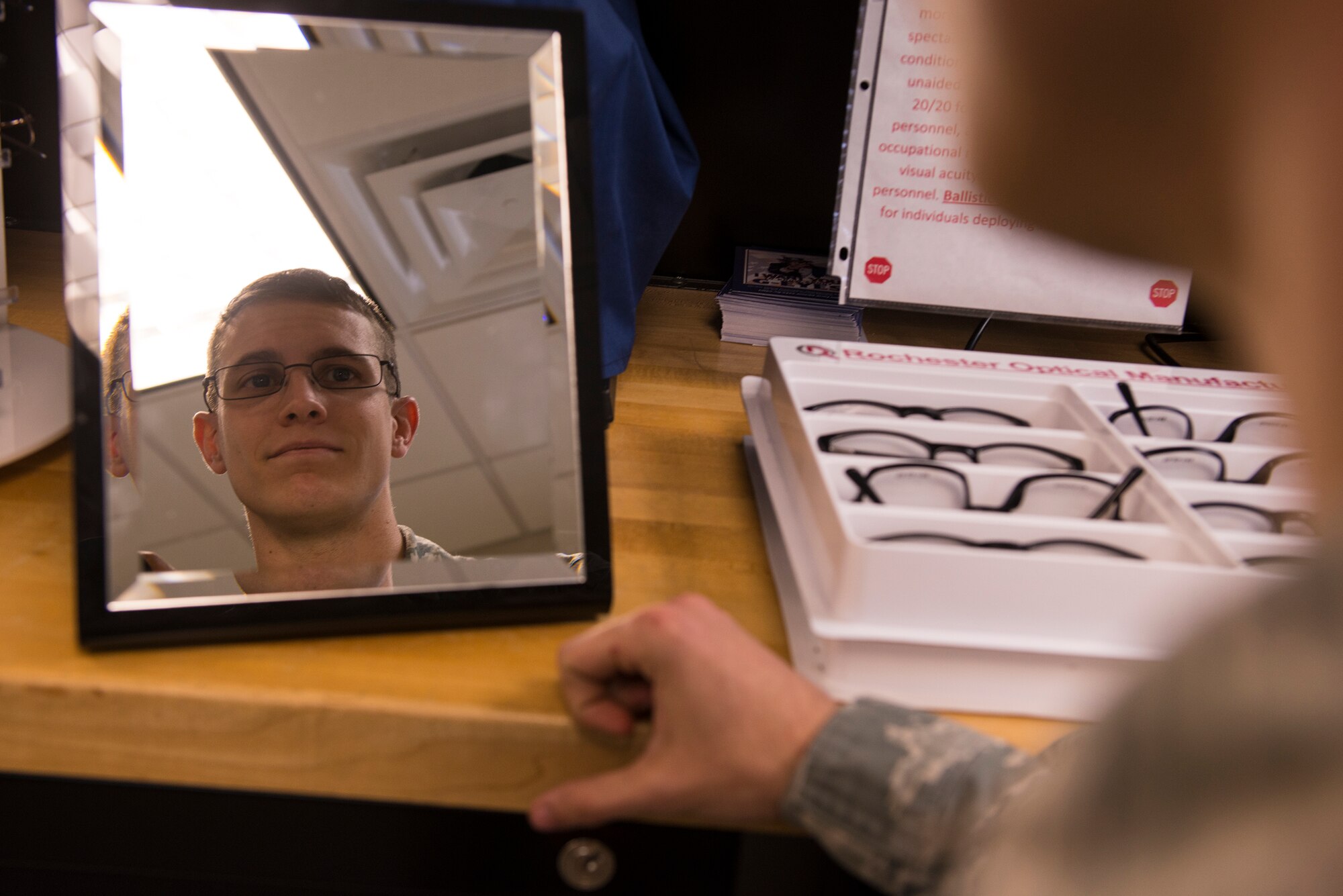 U.S. Air Force Senior Airman River Carson, 23d Medical Group public health technician, tries on a pair of glasses during an optometry appointment Feb. 4, 2014, at Moody Air Force Base, Ga. The optometry clinic offers Team Moody members free annual exams, two pairs of eye glasses, gas mask inserts and ballistic eyewear. (U.S. Air Force photo by Airman 1st Class Ceaira Tinsley/Released)