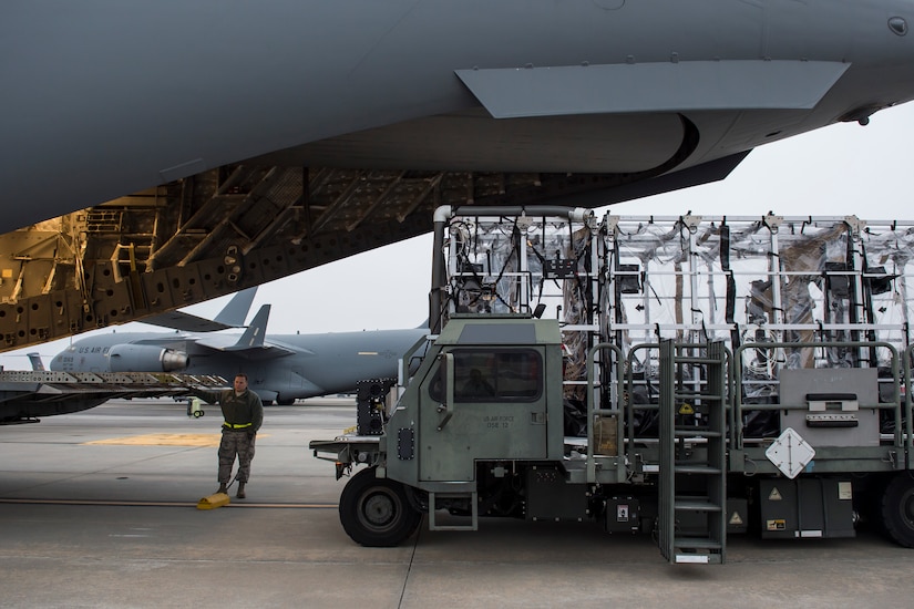 Staff Sgt. Cody Swayne loads a Transport Isolation System aboard a C-17 Globemaster III, Jan. 14, 2015 at Joint Base Charleston, S.C., during a training exercise. Charleston is one of two bases in the United States that has trained with the TIS, a medical pod which provides a way to safely transport patients with infectious diseases. Swayne is a member of the 437th Aerial Port Squadron. (U.S. Air Force photo/Senior Airman Jared Trimarchi)  