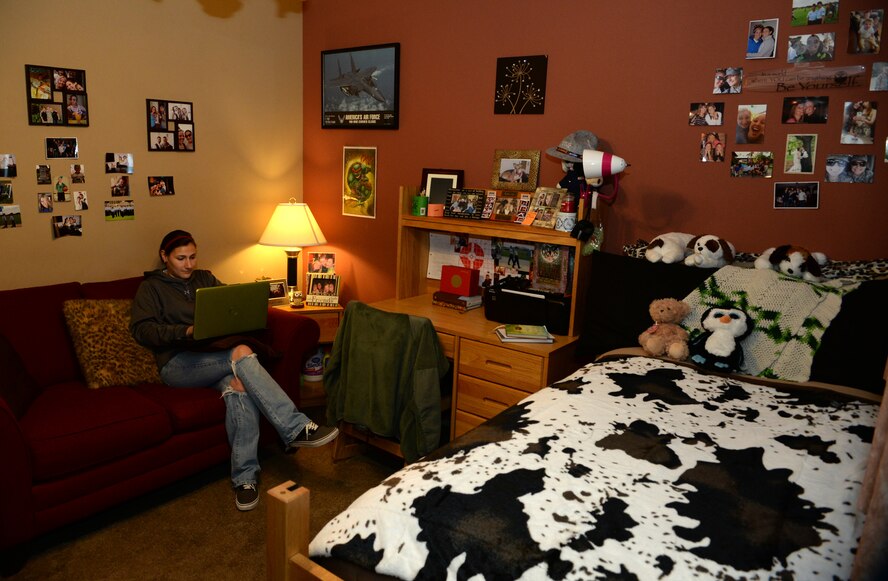 Senior Airman Shellby Matullo, 2nd Bomb Wing public affairs broadcast journalist, communicates with her family on her computer in her dorm room on Barksdale Air Force Base, La., Feb. 2, 2015. Matullo budgets her income to keep her dorm clean and give it her own personal touch to make it feel more like home. (U.S. Air Force photo/Airman 1st Class Curt Beach)