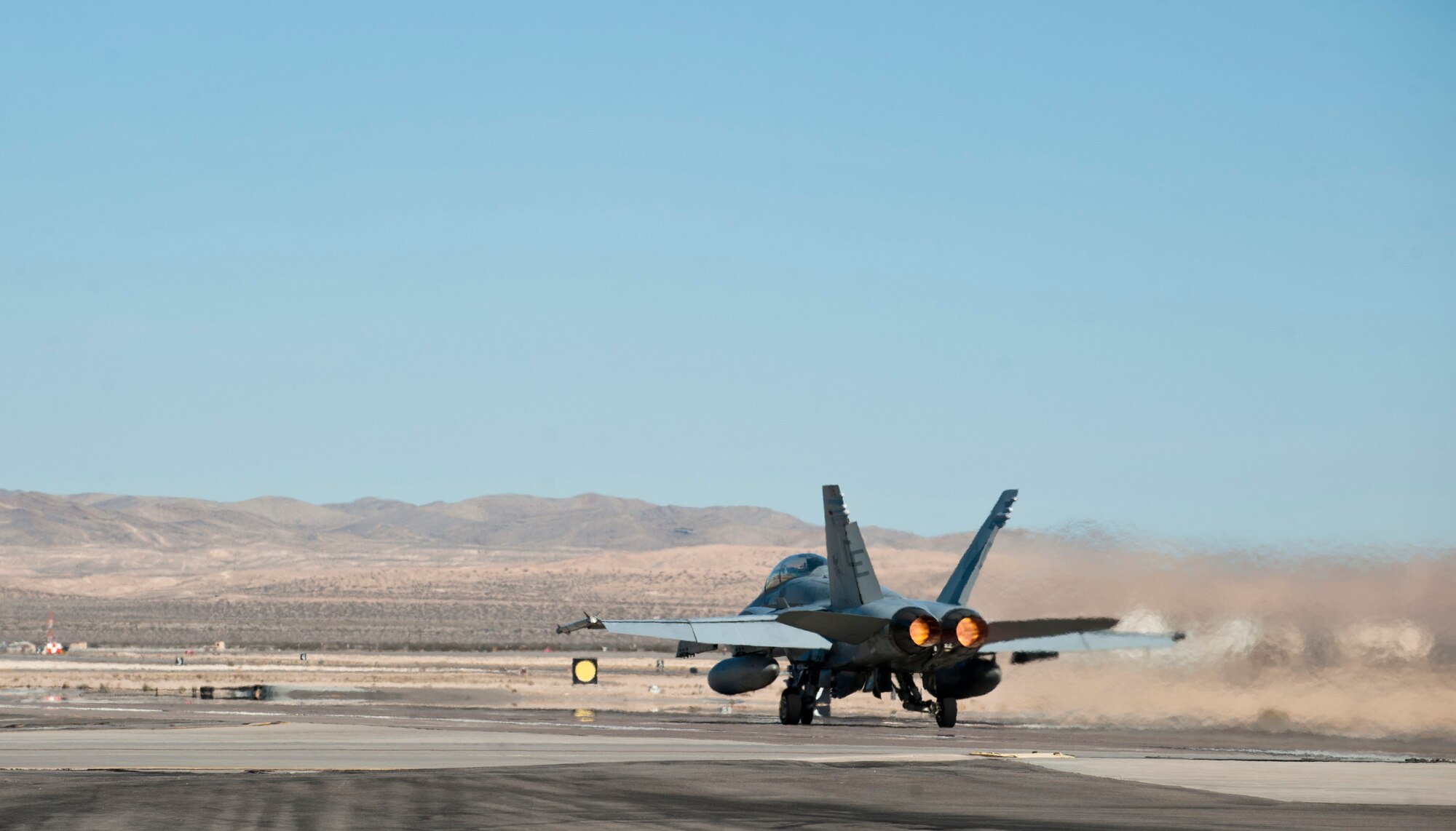 A U.S. Marine Corps F/A-18 Hornet assigned to Marine Fighter Attack Squadron 225, Marine Corps Air Station Miramar, Calif., takes off during Red Flag 15-1 at Nellis Air Force Base, Nev., Feb. 2, 2015. Red Flag missions are conducted on the 2.9 million acre Nevada Test and Training Range with 1,900 possible targets, realistic threat systems and opposing enemy forces. (U.S. Air Force photo by Senior Airman Thomas Spangler)