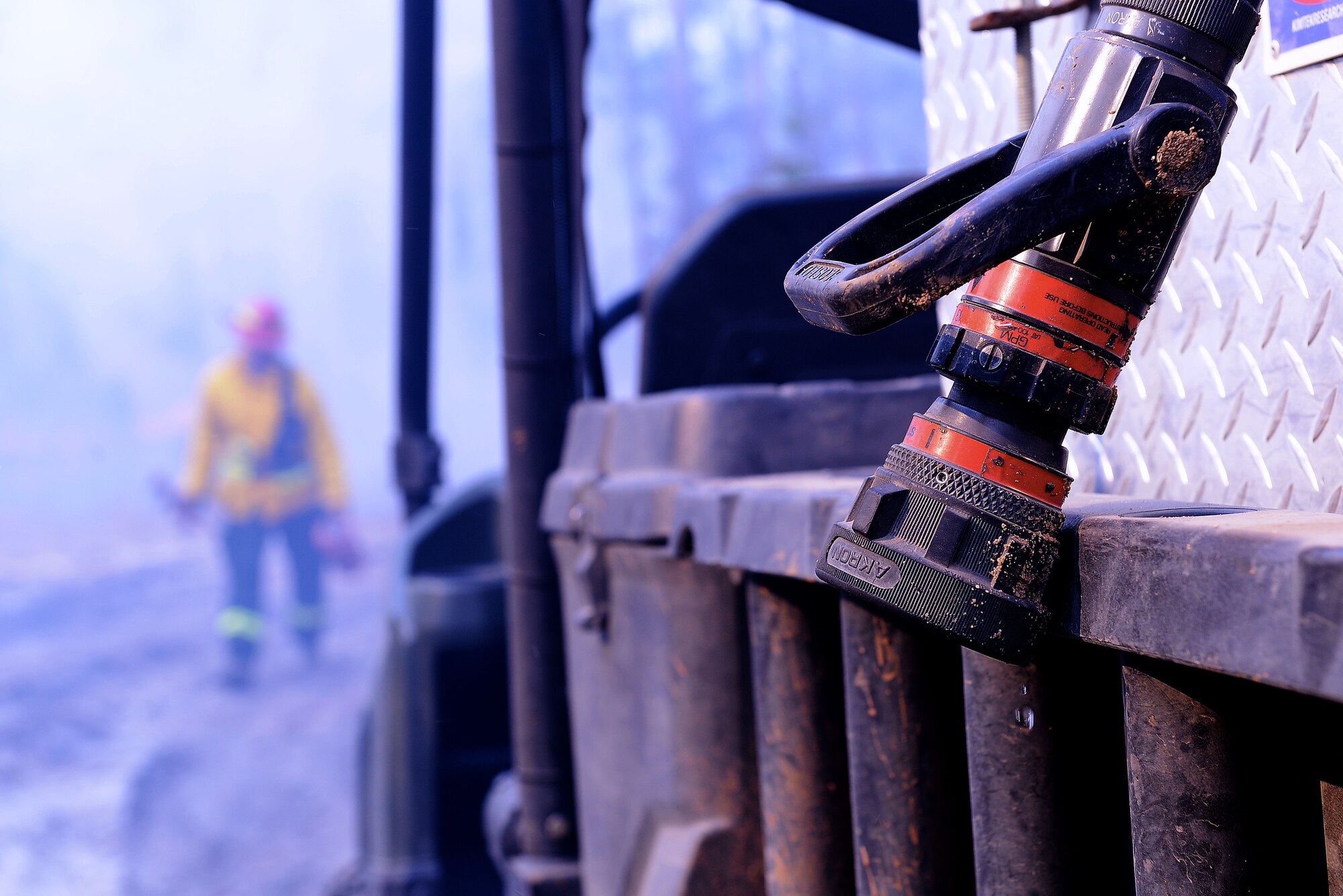 A drop of water falls from a fire hose during prescribed burning at Poinsett Electronic Combat Range, Sumter, S.C., Jan. 28, 2015. The prescribe burn team used water to manage areas that became too hot, ensuring the safety of the environment and the team out on the range. (U.S. Air Force photo by Airman 1st Class Diana M. Cossaboom/Released)